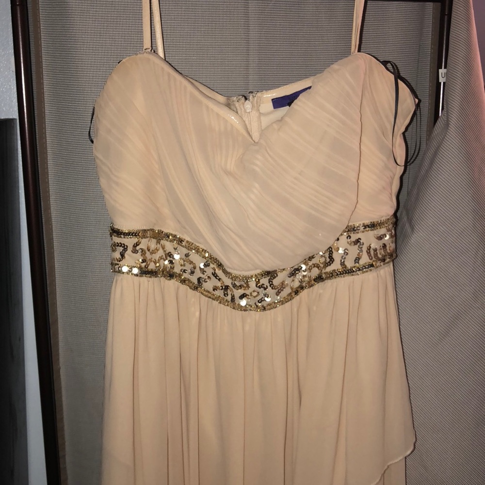Tan dress with gold details.
